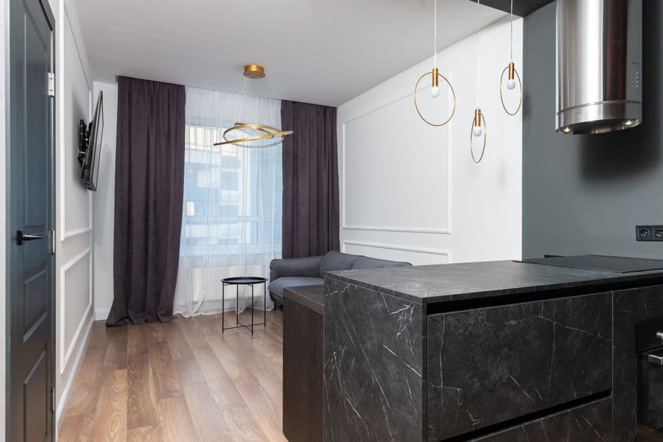 Sleek contemporary apartment interior with elegant furniture and minimalist decor.