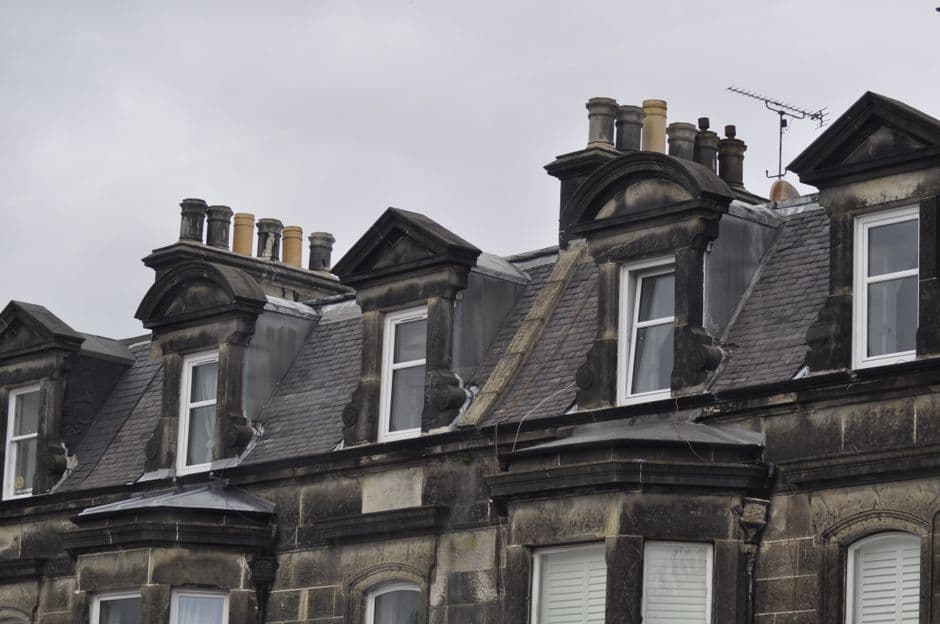 Classic Edinburgh architecture featuring historic dormer windows and slate roofs.
